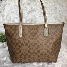 Load image into Gallery viewer, COACH signature coated canvas handbag in light brown with gold trimming - mystic-beauty-international-make-up-store